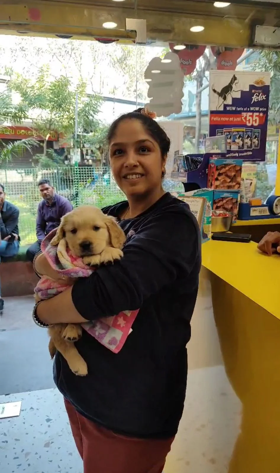 Happy customer with puppy at Kyra Pet Shop